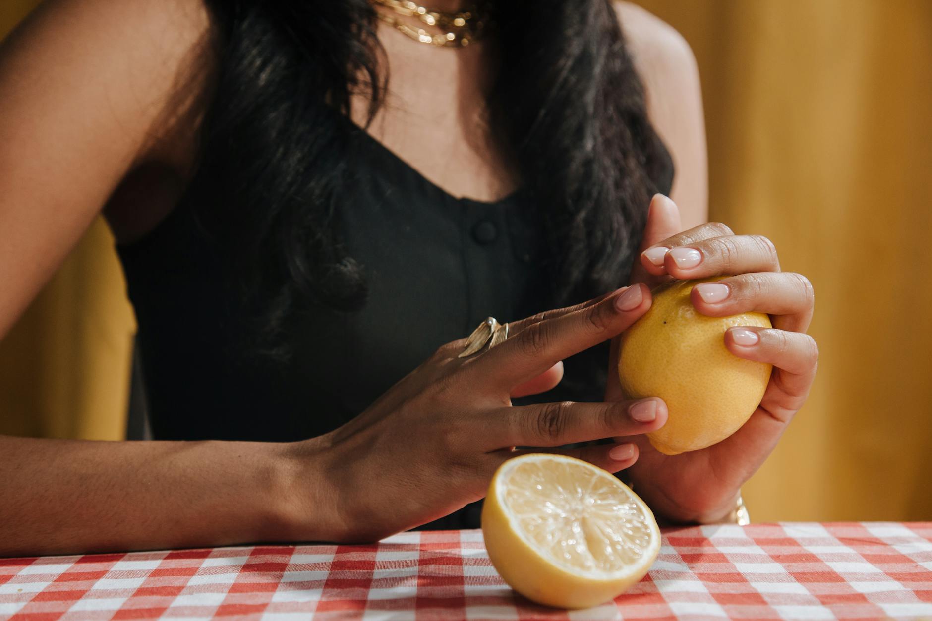 Woman holding fresh lemon, symbolizing renewal and sensitivity restoration