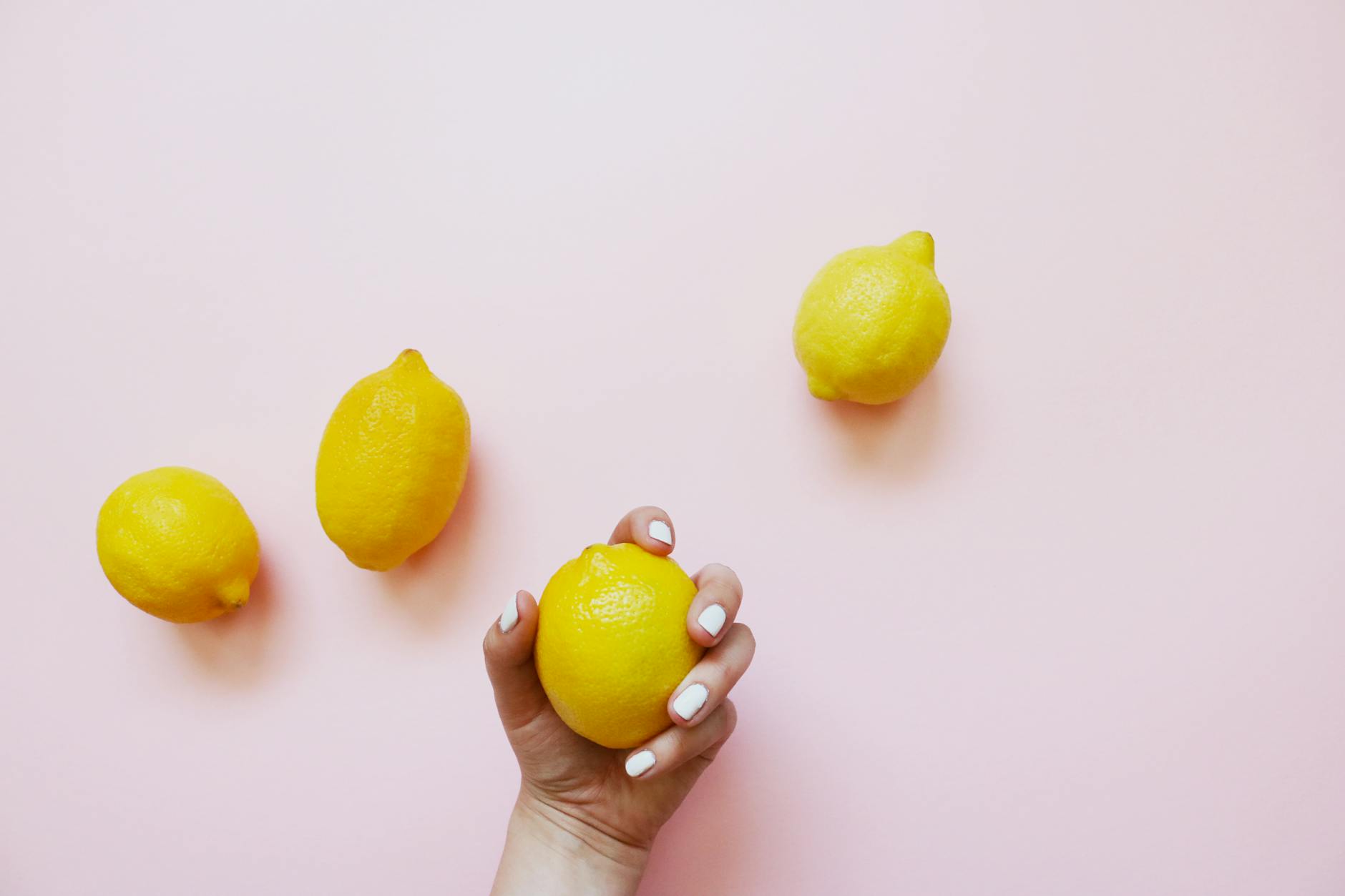 Two hands holding silicone vibrators together against a pastel background, symbolizing shared intimacy and reconnection