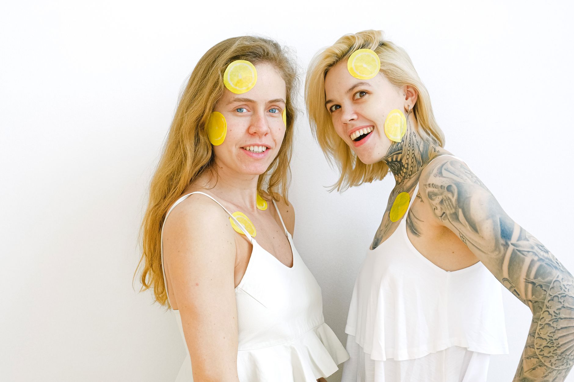 Colorful vibrators displayed on bright yellow background in studio lighting