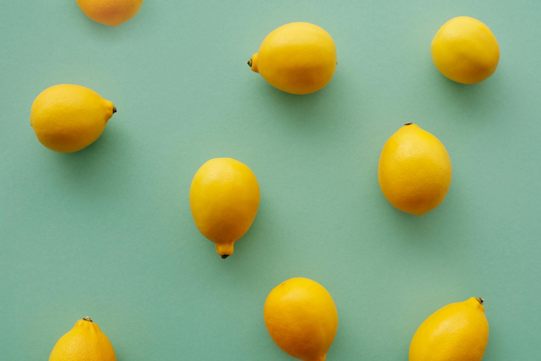Close-up of hands holding fresh lemons, symbolizing natural sensation and body awareness